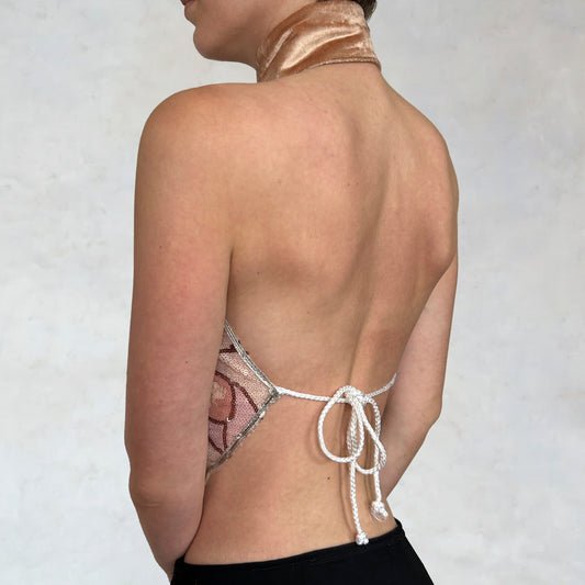 Top con paillettes e motivo floreale